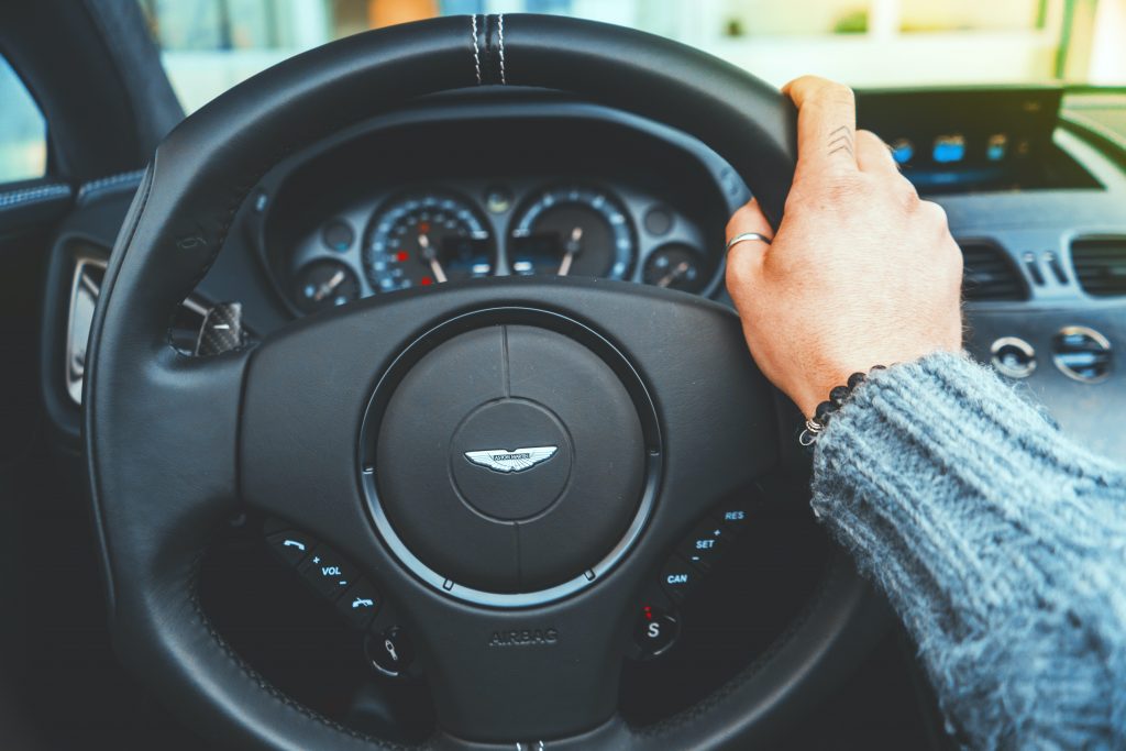 woman's hand on steering wheel