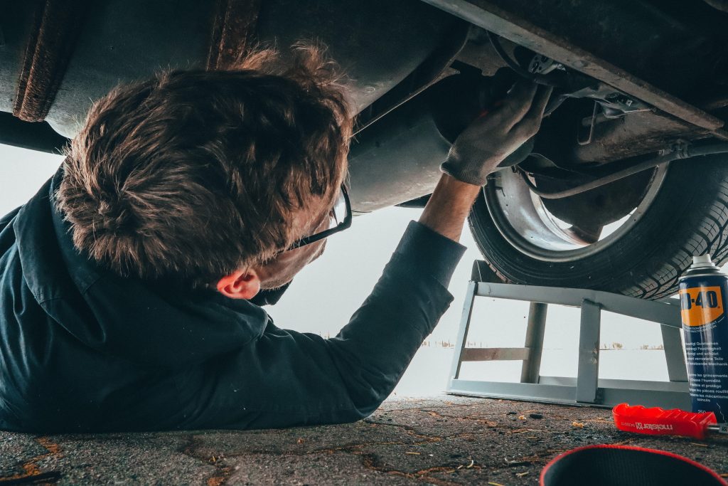 mechanic working under car